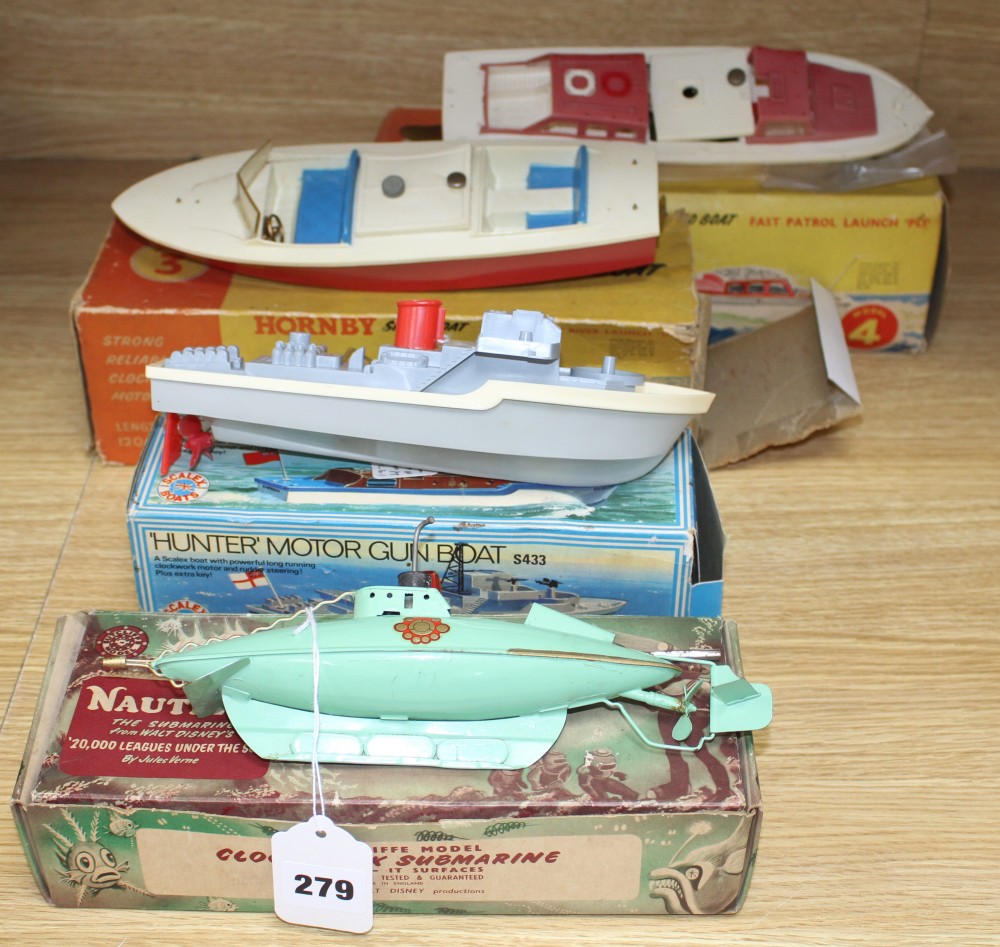 A boxed Sutcliffe model tinplate clockwork nautilus submarine, a boxed Scalex Hunter motor gun boat and two Hornby plastic bodied speed